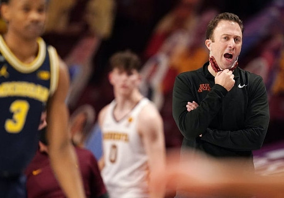 Zeb Jackson (3) and Minnesota Head Coach Richard Pitino