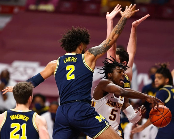 Franz Wagner (21), Isaiah Livers (2), Hunter Dickinson (1), and Mike Smith (12)