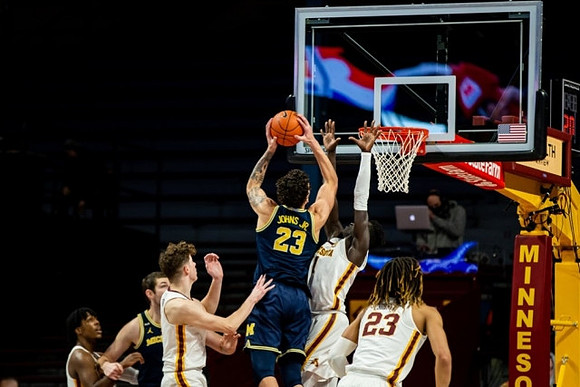 Hunter Dickinson (1) and Brandon Johns Jr. (23)