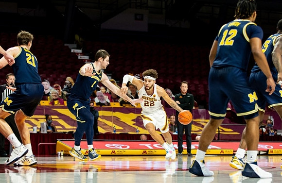 Franz Wagner (21), Hunter Dickinson (1), Mike Smith (12), and Chaundee Brown Jr. (15)