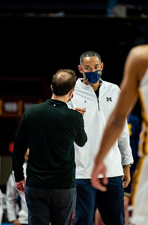 Minnesota Head Coach Richard Pitino and Juwan Howard