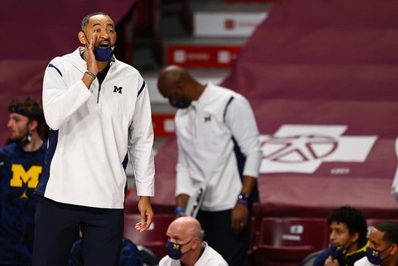 Juwan Howard and Phil Martelli