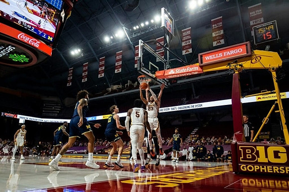 Chaundee Brown Jr. (15), Isaiah Livers (2), Franz Wagner (21), and Mike Smith (12)