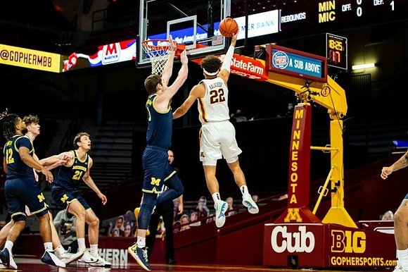 Mike Smith (12), Franz Wagner (21), and Hunter Dickinson (1)