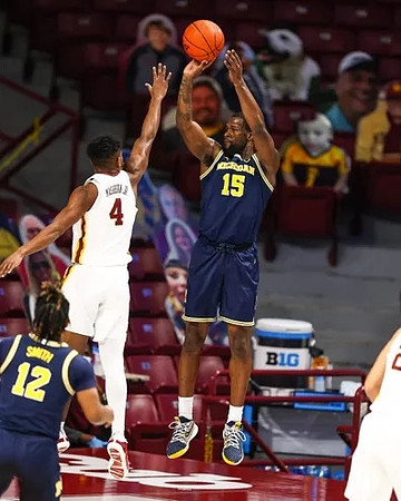 Mike Smith (12) and Chaundee Brown Jr. (15)
