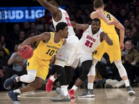 Derrick Walton Jr. (10) and Mark Donnal (34)