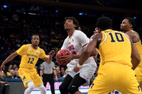 Muhammad-Ali Abdur-Rahkman (12), Derrick Walton Jr. (10), and Zak Irvin (21)