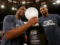 Derrick Walton Jr. (10) and Zak Irvin (21)