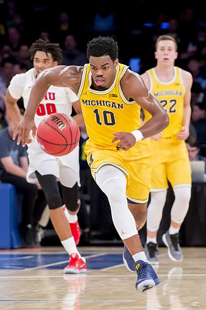 Derrick Walton Jr. (10) and Duncan Robinson (22)
