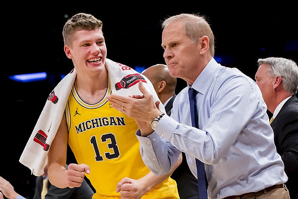 Moritz Wagner (13) and John Beilein