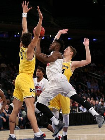 D.J. Wilson (5) and Mark Donnal (34)