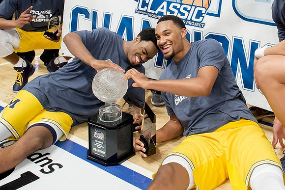 Derrick Walton Jr. (10) and Zak Irvin (21)