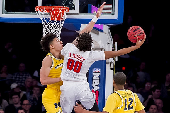 D.J. Wilson (5) and Muhammad-Ali Abdur-Rahkman (12)