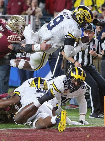 Mike McCray (9), Rashan Gary (3), and Bryan Mone (90)