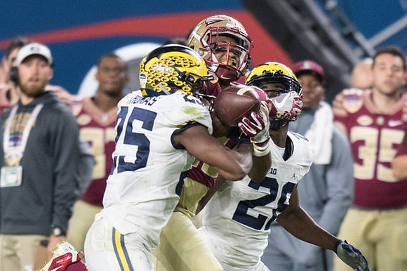 Dymonte Thomas (25) and Jourdan Lewis (26)