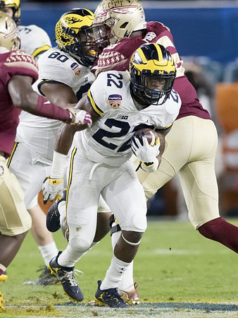 Khalid Hill (80) and Karan Higdon (22)