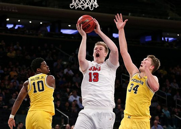 Derrick Walton Jr. (10) and Mark Donnal (34)