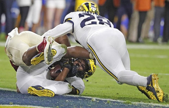 Jourdan Lewis (26) and Brandon Watson (28)