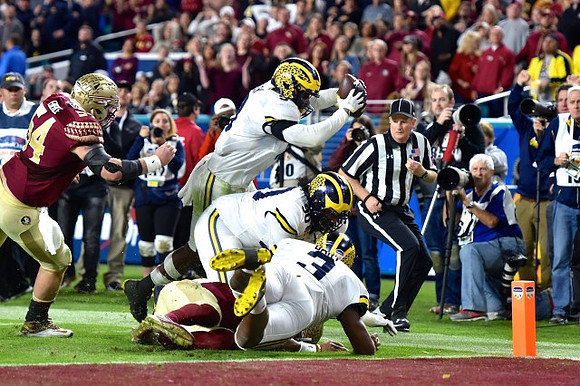 Mike McCray (9), Rashan Gary (3), and Bryan Mone (90)