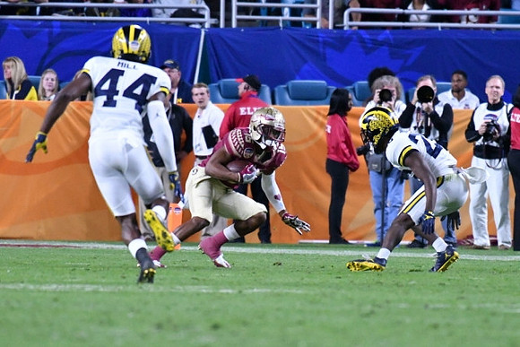 Delano Hill (44) and Dymonte Thomas (25)