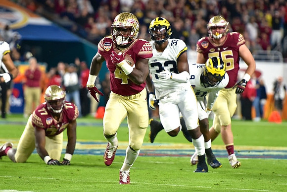 Taco Charlton (33) and Mike McCray (9)