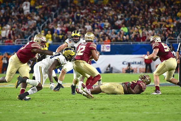 Taco Charlton (33) and Matthew Godin (99)