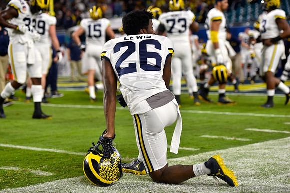 Jourdan Lewis (26) and Michigan Team