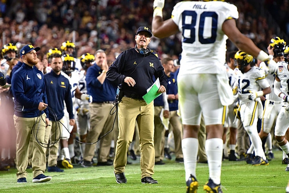 Khalid Hill (80) and Jim Harbaugh