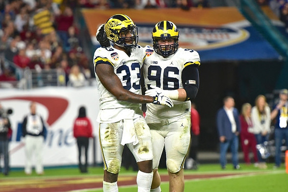 Taco Charlton (33) and Ryan Glasgow (96)