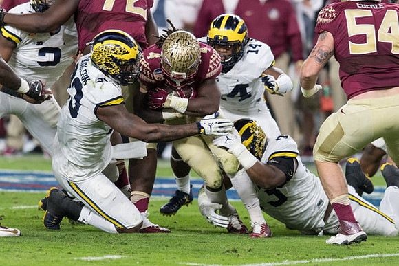 Rashan Gary (3), Taco Charlton (33), Josh Metellus (14), and Maurice Hurst (73)