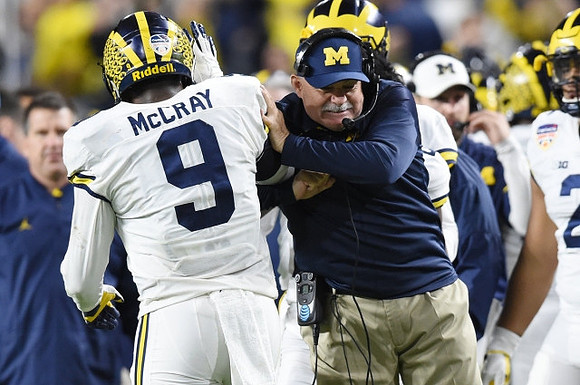 Mike McCray (9) and Don Brown