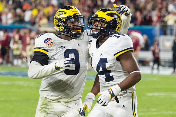 Mike McCray (9) and Josh Metellus (14)