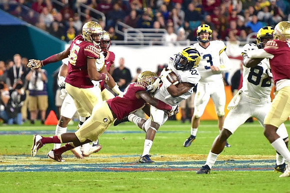 Karan Higdon (22), Wilton Speight (3), and Amara Darboh (82)