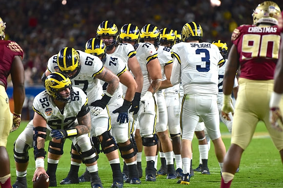 Wilton Speight (3) and Michigan Team