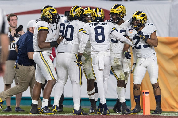 Bryan Mone (90), Channing Stribling (8), Taco Charlton (33), and Tyree Kinnel (23)