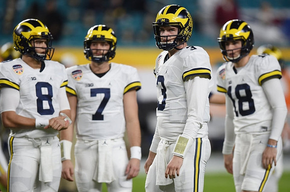 John O'Korn (8), Shane Morris (7), Wilton Speight (3), and Brandon Peters (18)