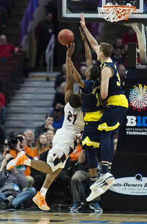 Muhammad-Ali Abdur-Rahkman (12) and Mark Donnal (34)