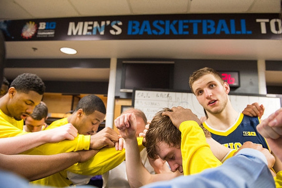 Max Bielfeldt (44) and Michigan Team
