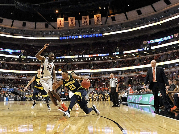 Mark Donnal (34), Zak Irvin (21), and Illinois Head Coach John Groce
