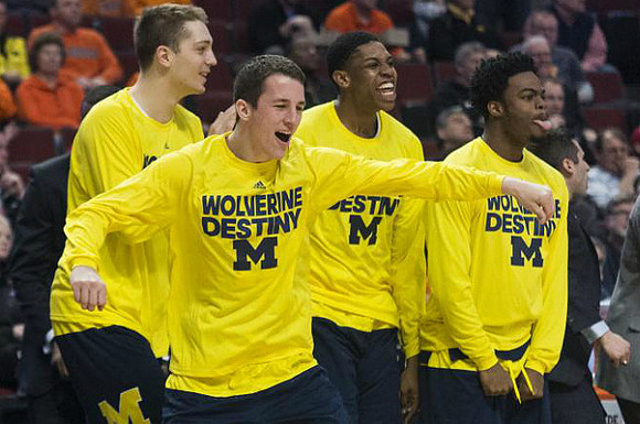 Mark Donnal (34), Andrew Dakich (11), Kameron Chatman (3), and Derrick Walton Jr. (10)