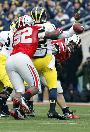 Ricky Barnum (52) and Devin Gardner (12)