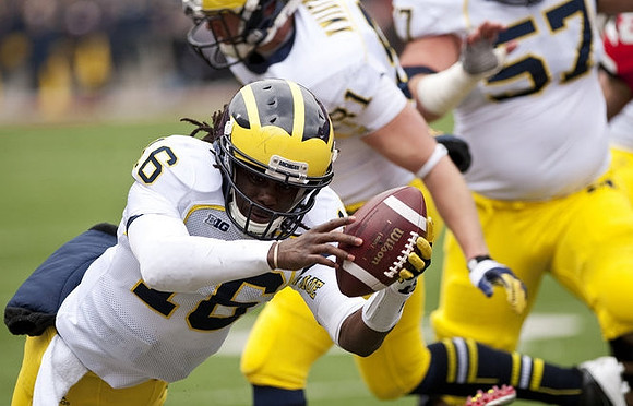 Denard Robinson (16), Mike Kwiatkowski (81), and Elliott Mealer (57)