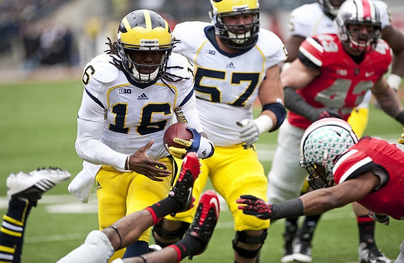 Denard Robinson (16) and Elliott Mealer (57)