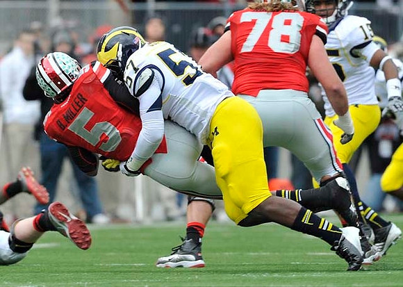 Frank Clark (57) and James Ross (15)