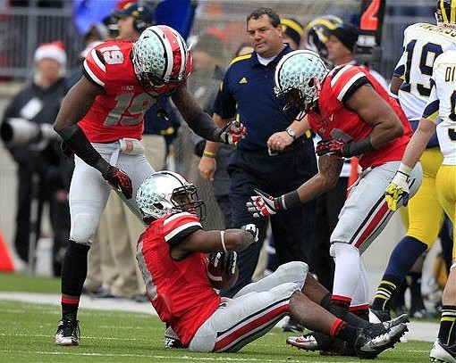 Devin Funchess (19) and Drew Dileo (9)