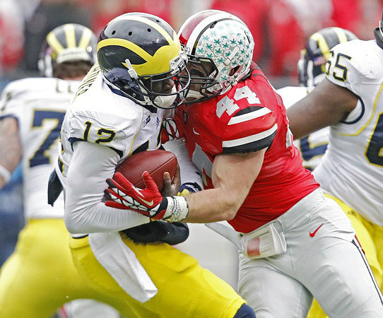 Taylor Lewan (77), Devin Gardner (12), and Patrick Omameh (65)