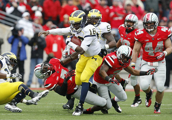 Denard Robinson (16), Ricky Barnum (52), and Stephen Hopkins (33)