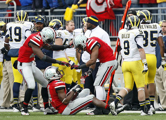 Devin Funchess (19), Joey Burzynski (56), Drew Dileo (9), and Joe Reynolds (85)
