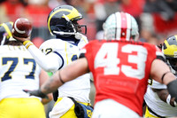 Taylor Lewan (77) and Devin Gardner (12)