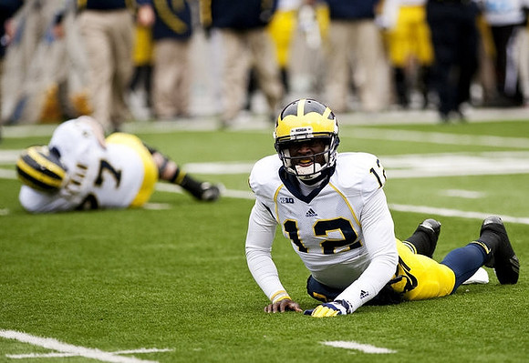 Taylor Lewan (77) and Devin Gardner (12)